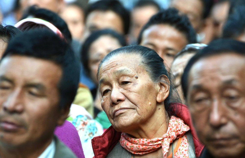 Women too want their share of say in politics. In this image an elderly woman listens attentively during a campaign rally in Dimapur. (Caisii Mao Photo)